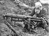 machine gunner with gas mask